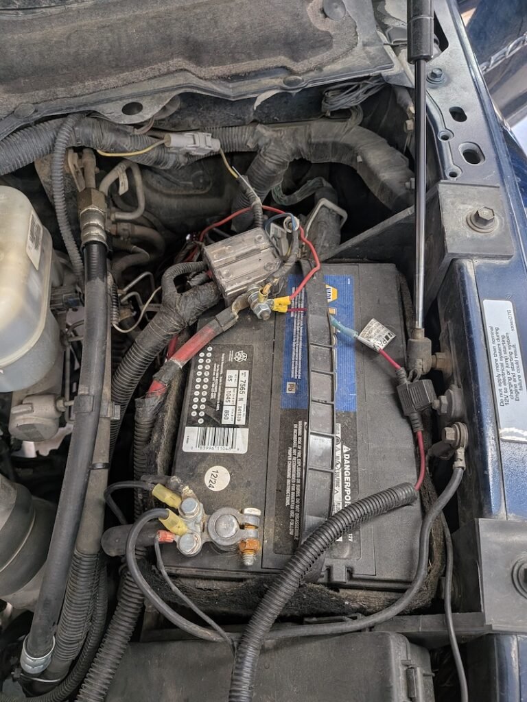 Car Battery inside a car hood
