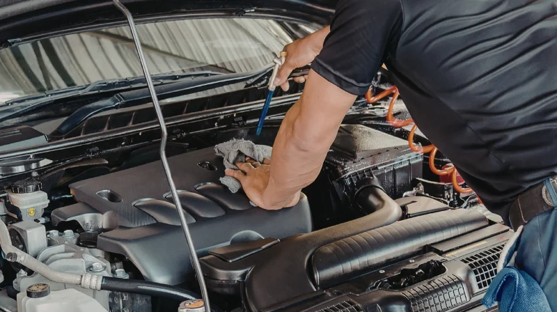 mechanic checking brakes