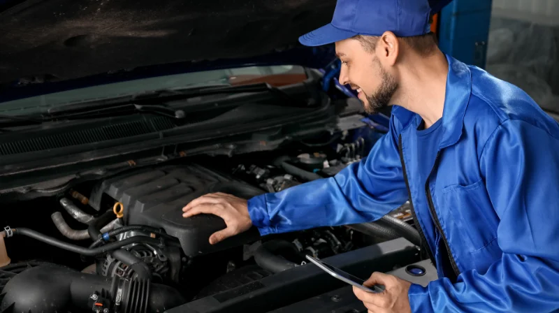 mechanic checking engine