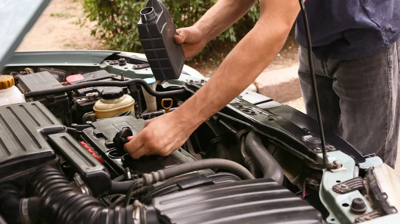 mechanic checking engine