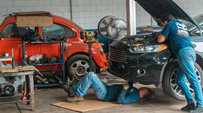 mechanic inspecting engine components