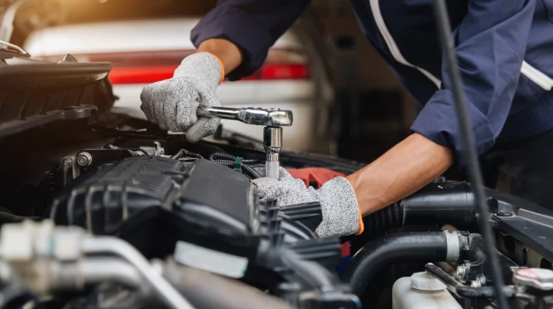 mechanic inspecting engine components