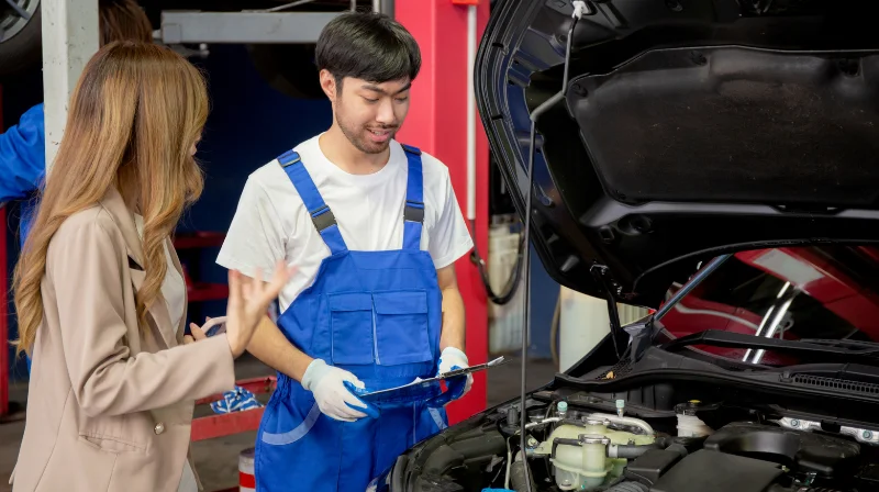 mechanic talking to customer
