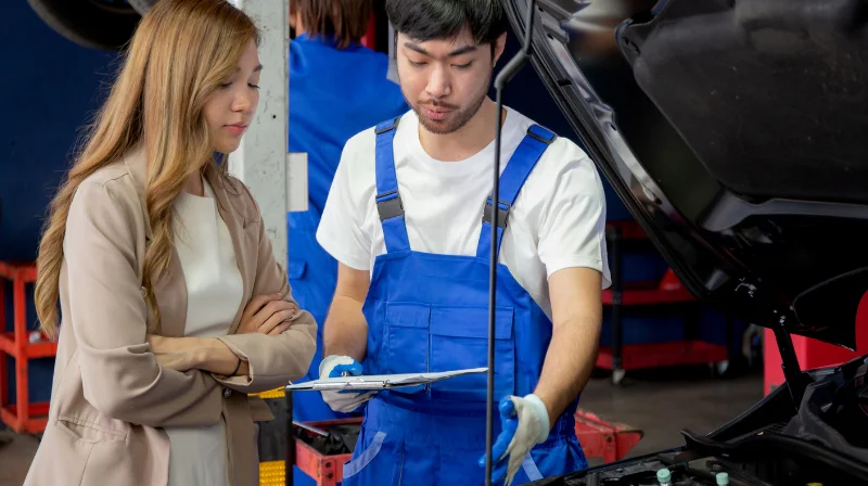 mechanic talking to customer
