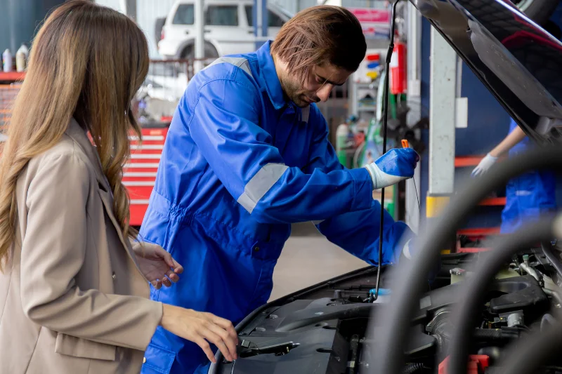 mechanic talking with customer